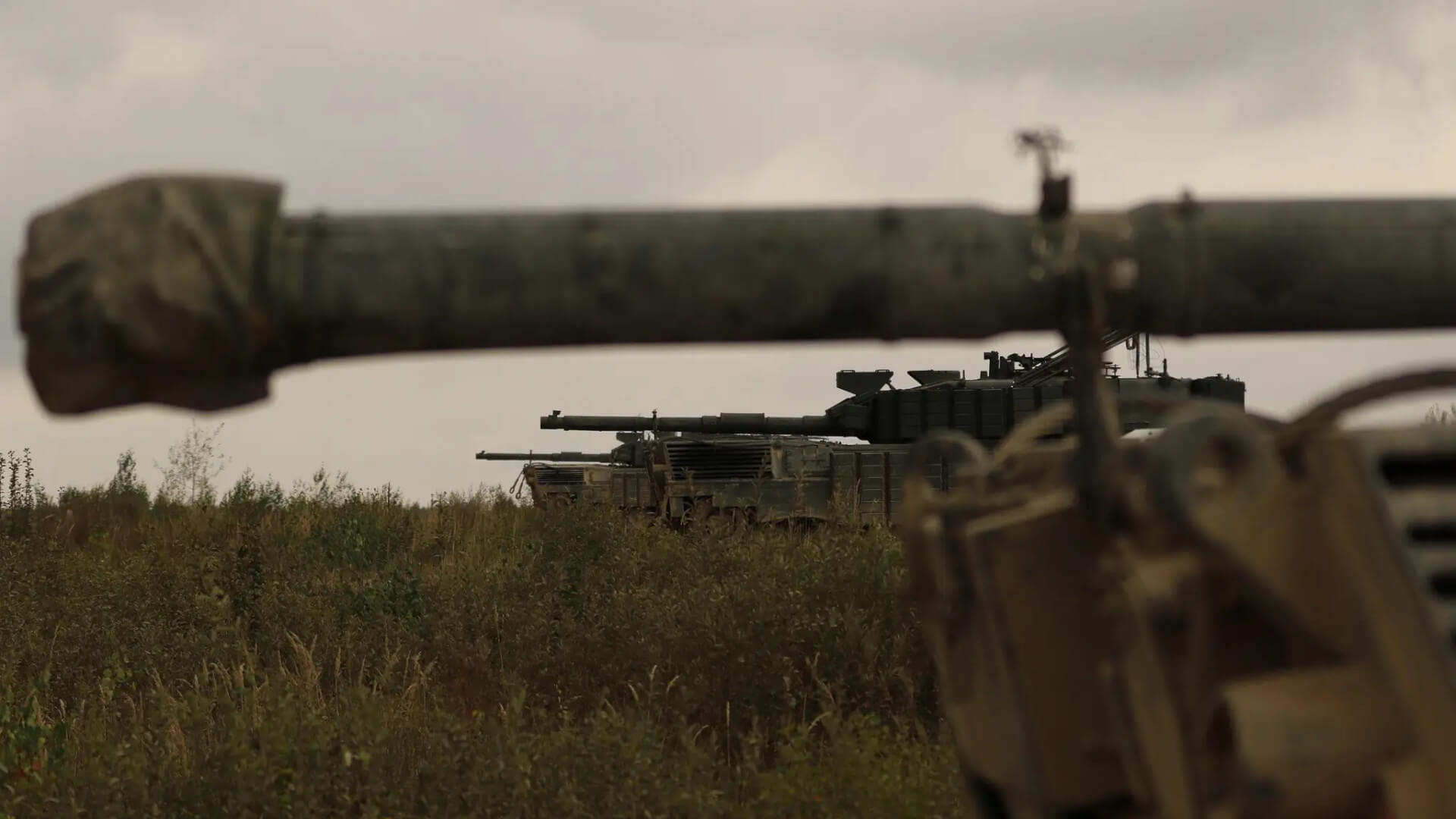 Several Leopard 1A5 MBTs with additional reactive armour lined up