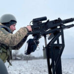Ukrainian soldier operates a pickup truck-based AA system